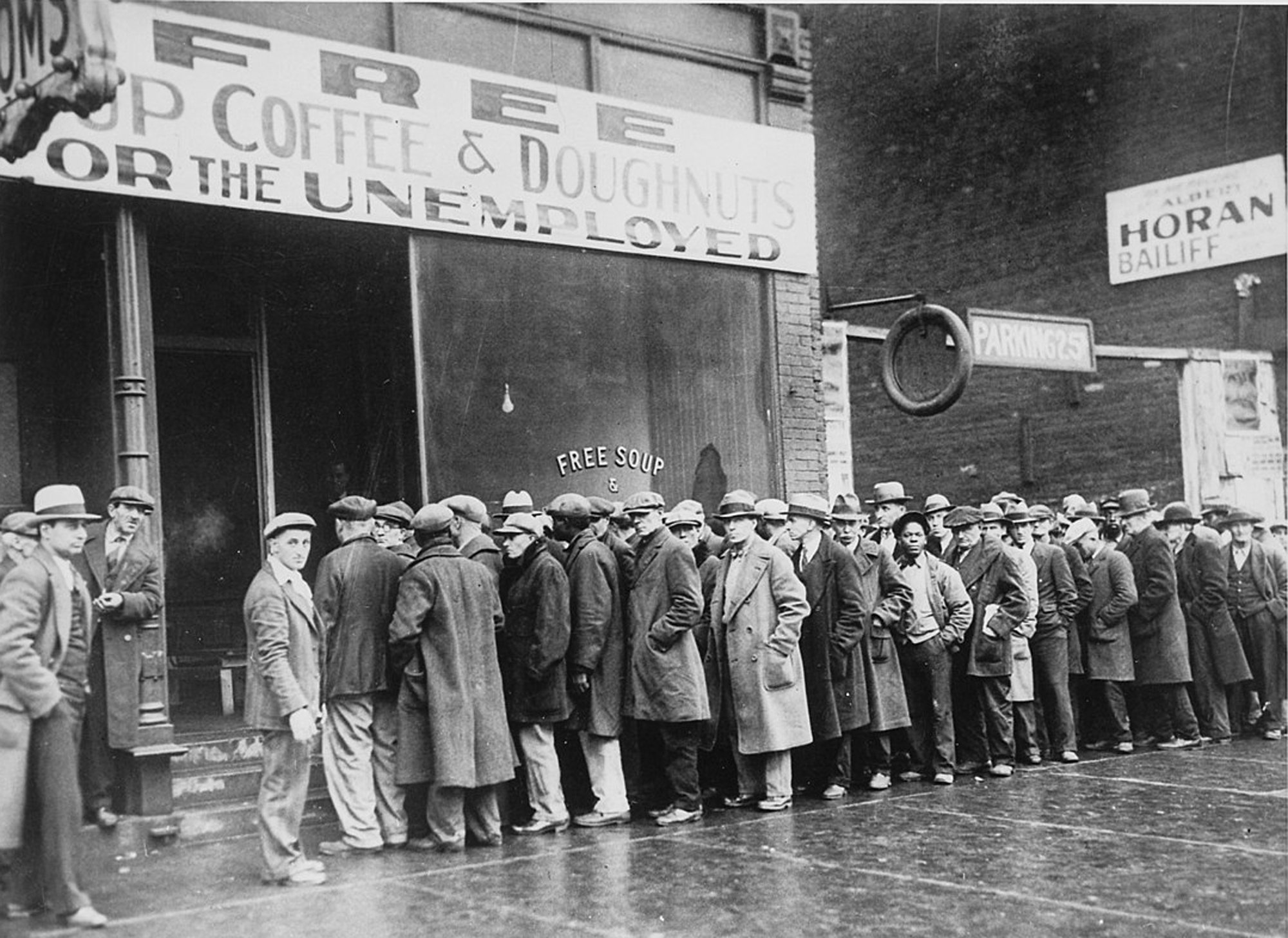 dustbowl_unemployed_men_queued_outside_a_depression_soup_kitchen_1931_-_nara